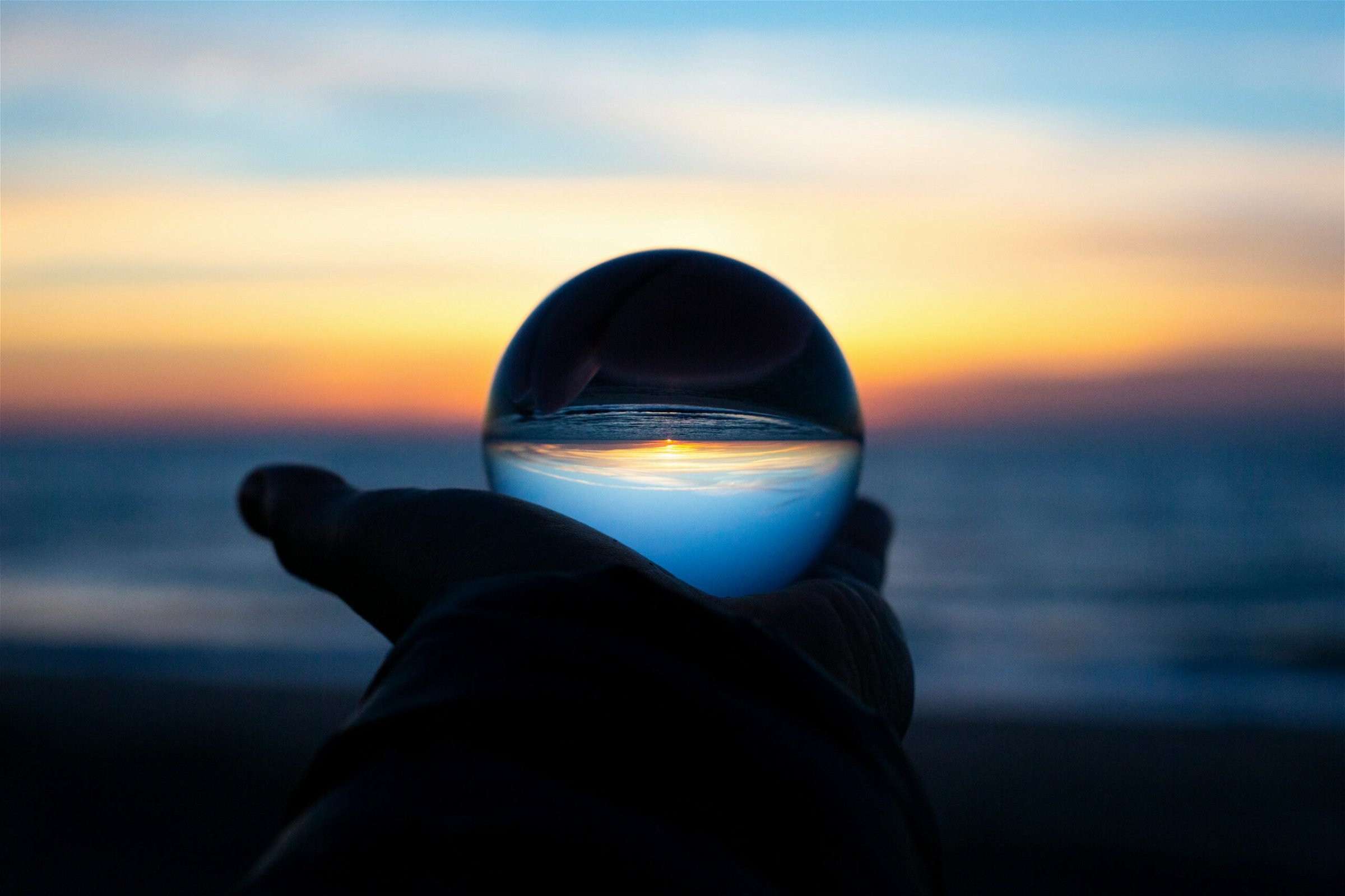 Image of a hand holding a crystal ball - Destination Certification